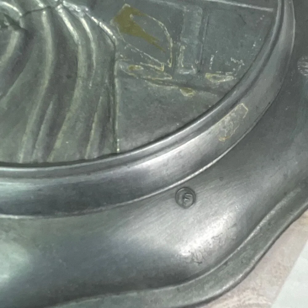 Vintage Cheswick PA action industries high relief pewter. Woman spinning yarn.